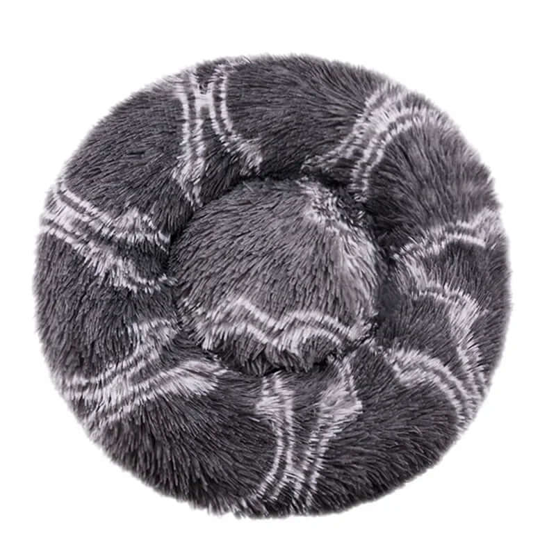 Super soft round pet bed with plush fabric, ideal for dogs and cats, ensuring warmth and comfort.