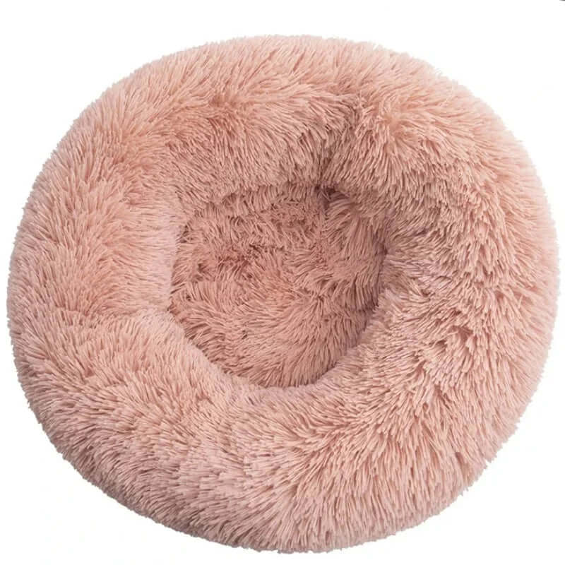 Soft round pink pet bed, plush and warm, ideal for small to large dogs and cats.