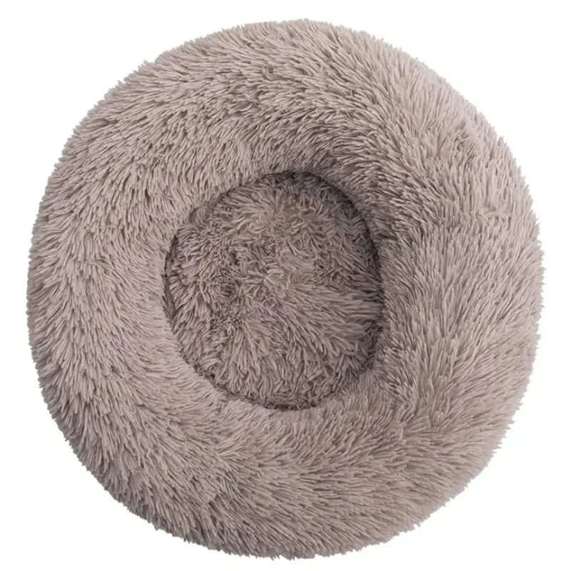 Round soft plush pet bed for small to large dogs and cats, providing warm and cozy sleeping space.