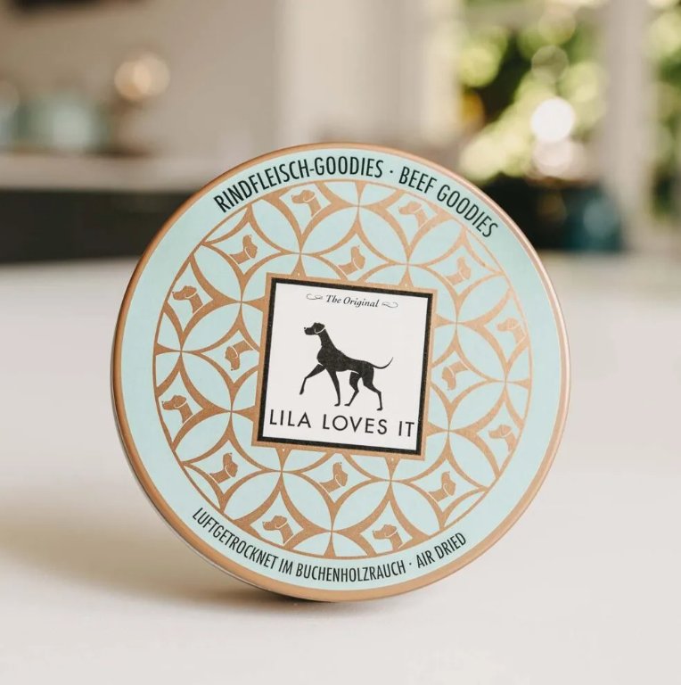 Lila Loves It beef goodie tin featuring a dog logo and decorative design.