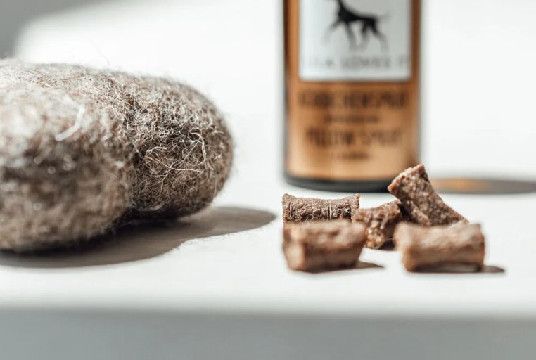 Lila Loves It gift box products including a felt toy and natural treats for dogs.