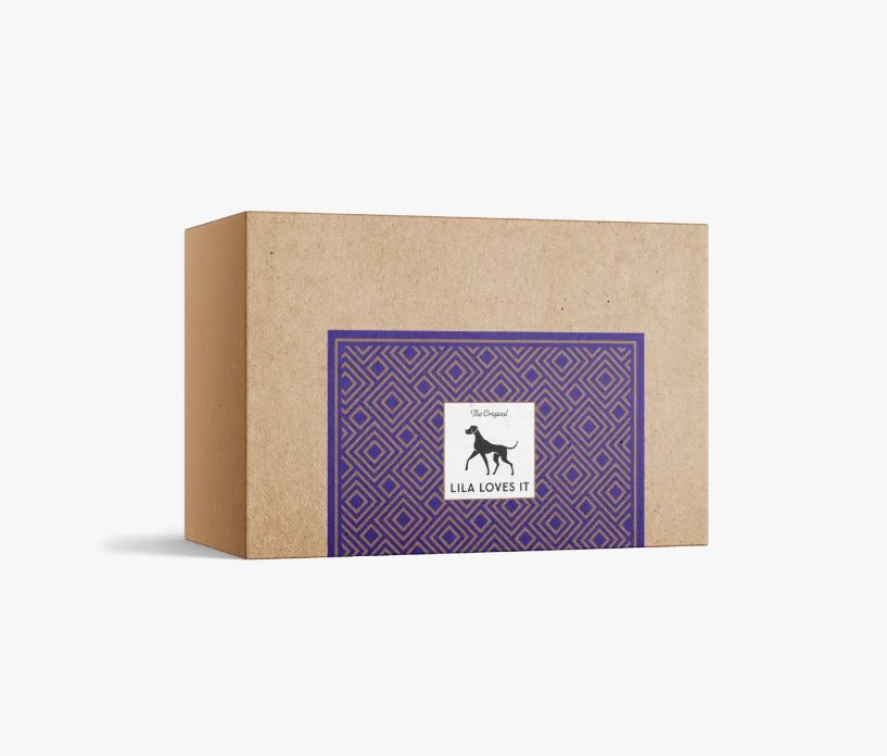 Lila Loves It packaging box for chicken snacks for gourmet dogs, featuring a purple design.