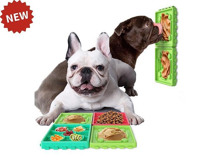 Two happy dogs using slow feeder mats for healthy eating, featuring different compartments and peanut butter.
