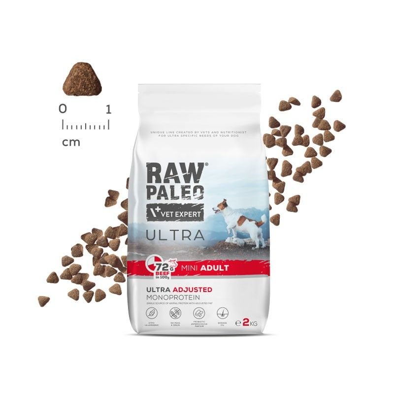 Raw Paleo Ultra Mini Adult Beef dog food bag with kibble on a white background, suitable for small breed adult dogs.