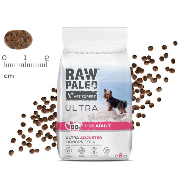 RAW PALEO Ultra Mini Adult Pork dog food packaging with kibble size indicator, ideal for small breed adult dogs.